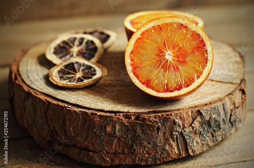 Fototapeta Naklejka Na Ścianę i Meble -  Tangerine open on wood