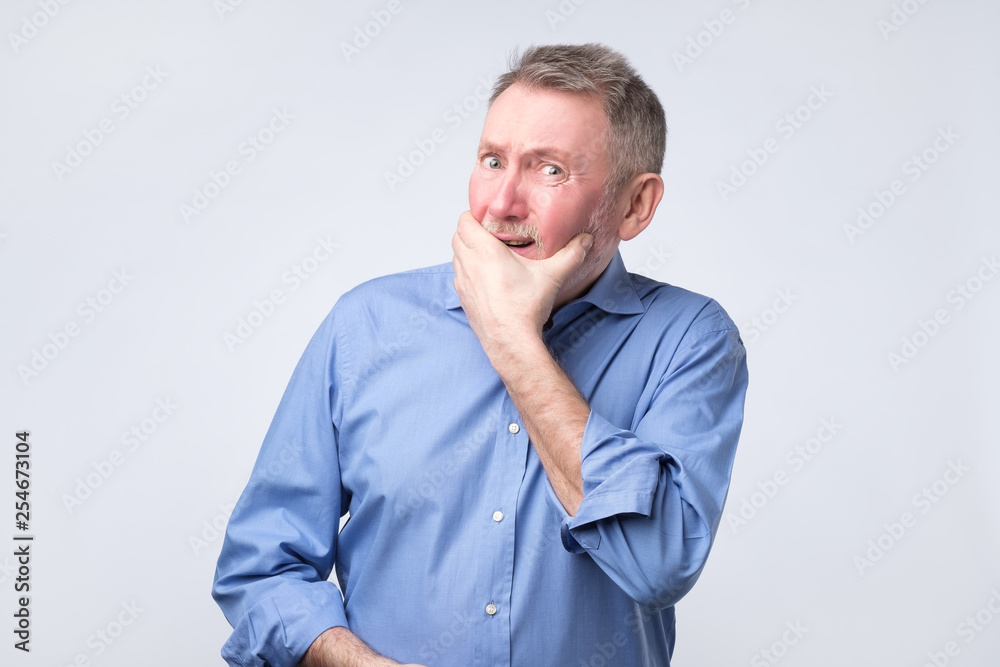 Caucasian senior grandfather curves lips, looks doubtfully, thinks what to do. Caucasian senior grandfather curves lips, looks doubtfully, thinks what to do.