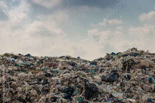 big garbage mountain with blue sky background