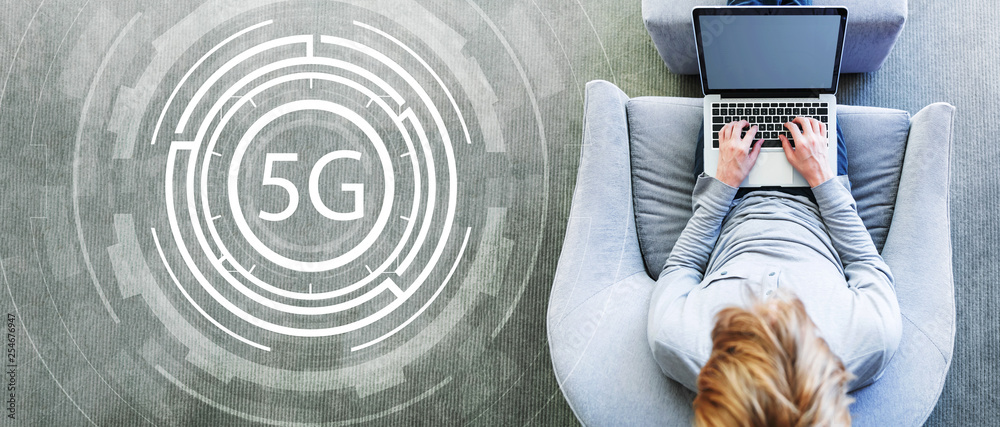 Plakat 5G network with man using a laptop in a modern gray chair
