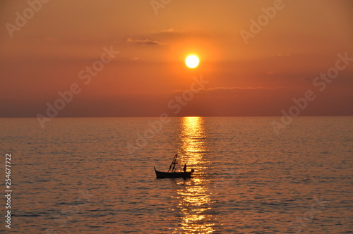 fishing boat at sunset in Camogli, Genoa province, Liguria, Italy © SIMONE