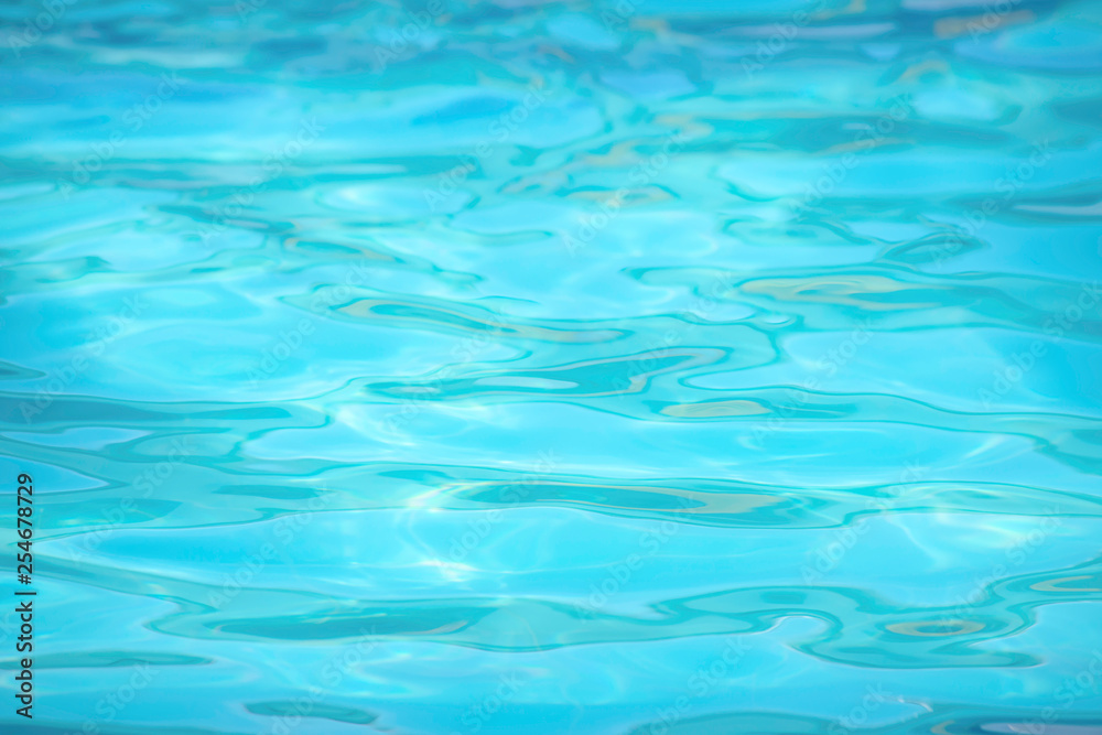 The blue water waves by wind and sunlight reflecting surface The blue water waves by wind and sunlight reflecting surface