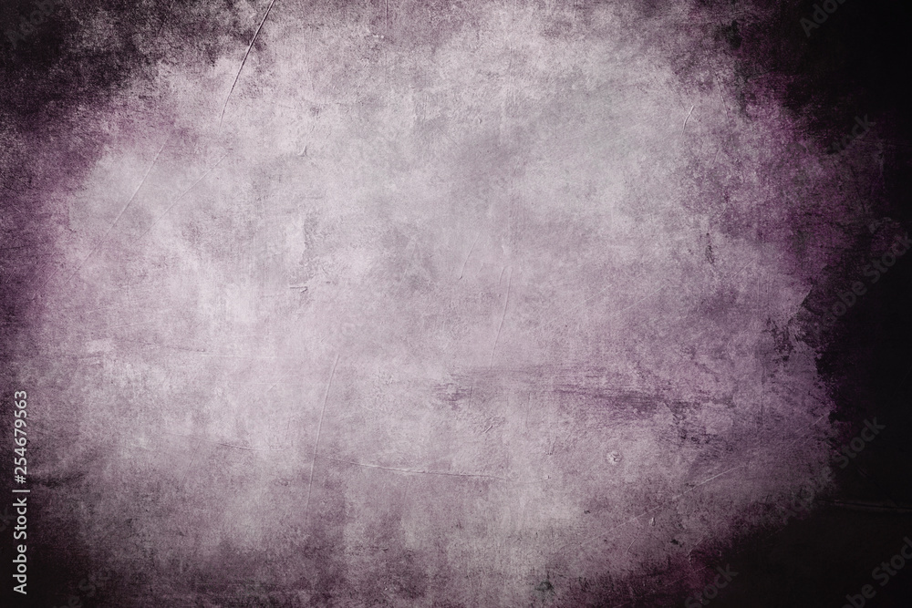 Old purple wall grungy background or texture with dark vignette borders