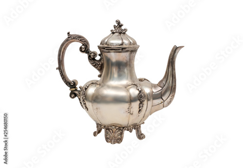 Antique silver kettle on a white background.