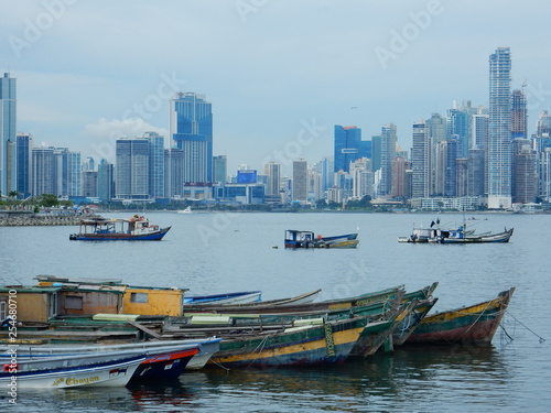 Panama city skyline in a cloudy day with fishing boats moored in the bay, Panama, Central America © SIMONE