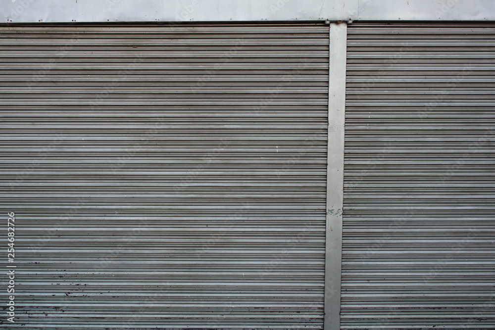Fototapeta premium Old Steel roller shutter doors closed.