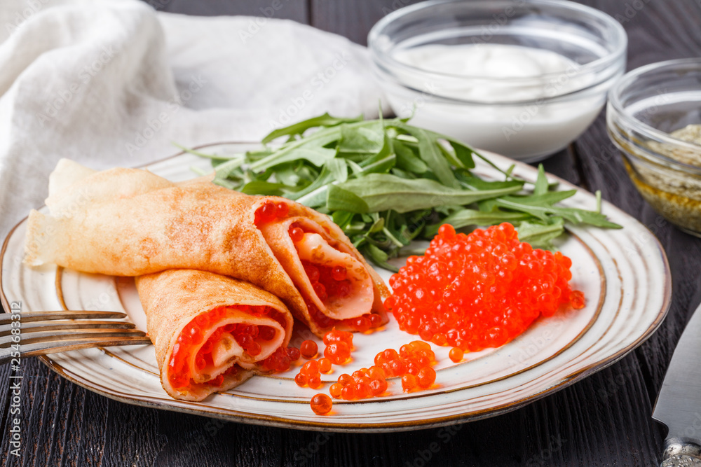 Pancakes with red caviar, carnival in Russiaa Pancakes with red caviar, carnival in Russiaa
