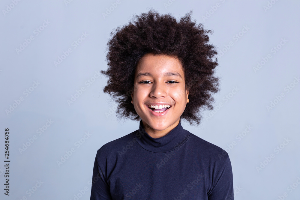 Dark-haired African American little person being extremely happy during photoshoot Dark-haired African American little person being extremely happy during photoshoot