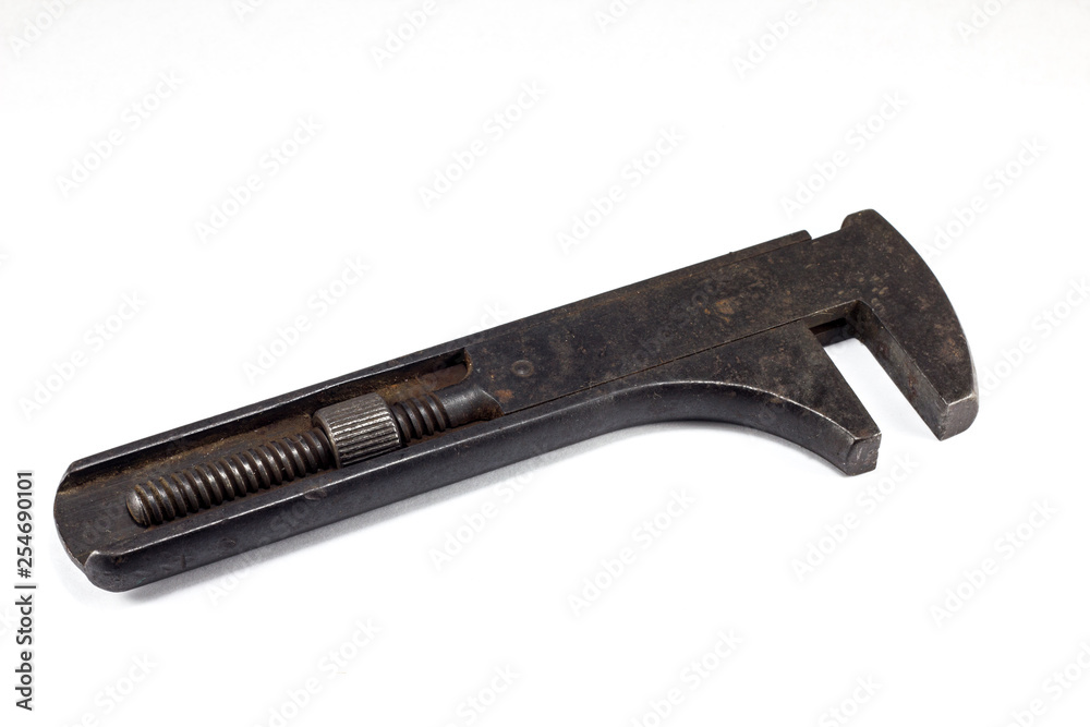 Sliding rusty wrench isolated on white background Sliding rusty wrench isolated on white background