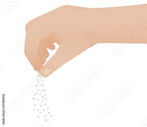 Main saupoudrant une petite quantité de grain
