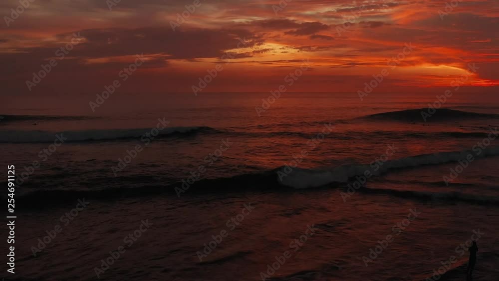 Fly in sunset time. Beautiful red sky, clouds,sea. 4K Aerial panorama. Ocean, sea surface in sunrise, sunset time with beautiful clouds and sun reflection in water Fly in sunset time. Beautiful red sky, clouds,sea. 4K Aerial panorama. Ocean, sea surface in sunrise, sunset time with beautiful clouds and sun reflection in water