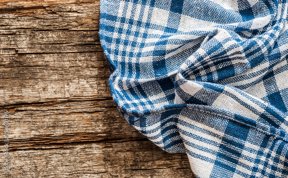 colorful tablecloth on wooden table. Top view colorful tablecloth on wooden table. Top view