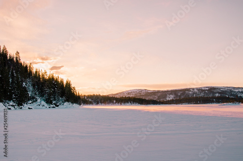 Fototapeta Naklejka Na Ścianę i Meble -  Sunrise over a frozen lake in Norway