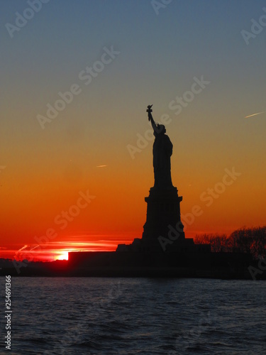 sunset at statue of liberty