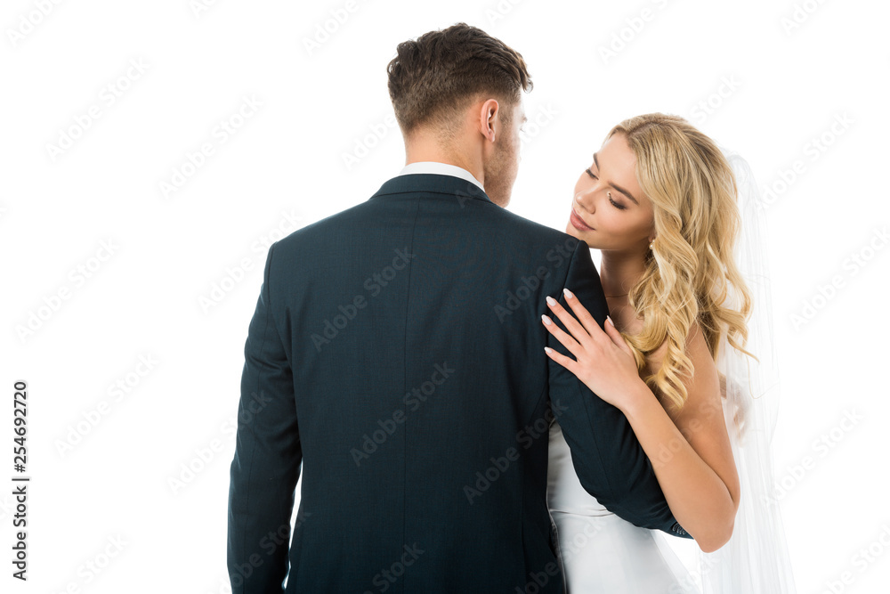 back view of bridegroom hugging beautiful bride isolated on white back view of bridegroom hugging beautiful bride isolated on white