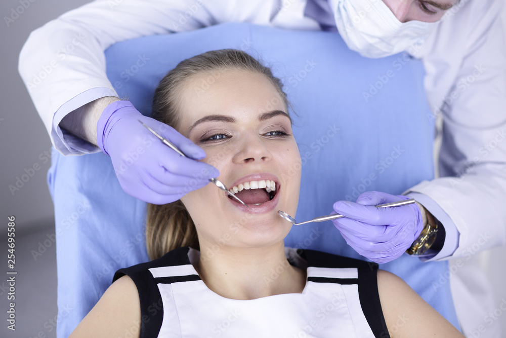 beautiful girl in the dental chair on the examination at the dentist