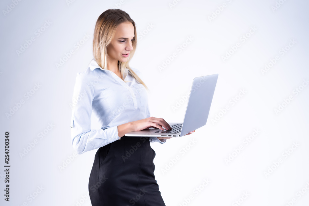 woman with laptop in hand on white background woman with laptop in hand on white background