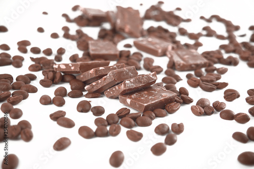 close up.pieces of chocolate and coffee beans isolated on white.photo with copy space