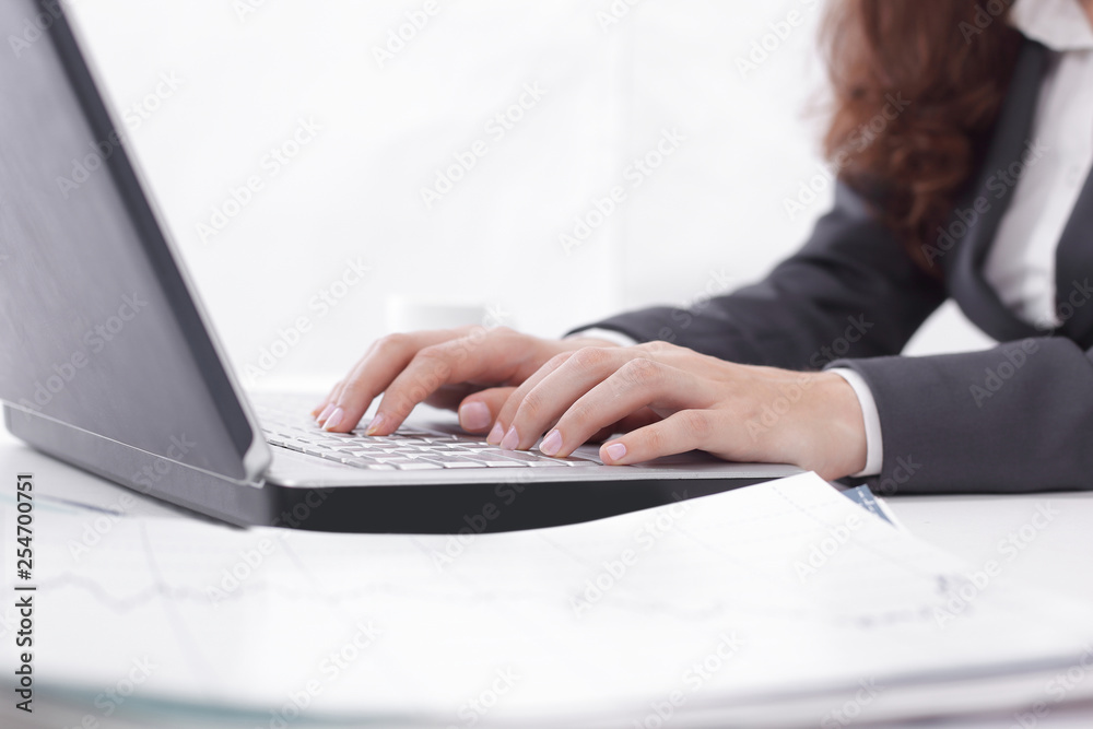 Woman working at home office hand on keyboard close up Woman working at home office hand on keyboard close up