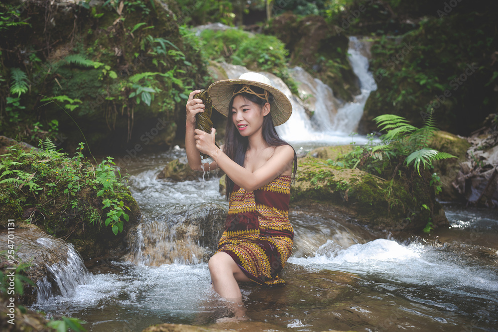 Fototapeta premium Happy bathing women at the natural waterfall.