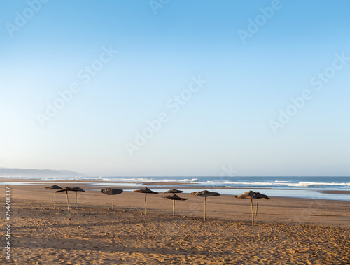 Coast of Sidi Kaouki, Morocco, Africa.  Coast with umbrellas. morocco's wonderfully sleepy surf town © GavranBoris