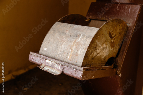 Old garbage chute in apartment building with cheap apartments - Rubbish chute in a Soviet block of flats photo