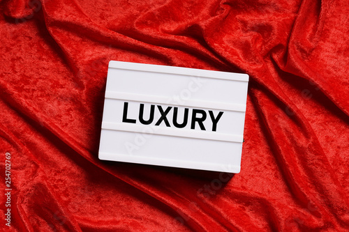 luxury text on lightbox or light box sign on red velvet background