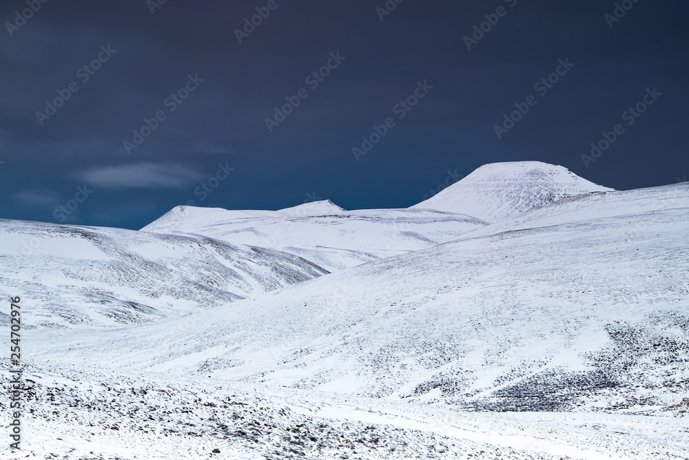 Mountains snow topped in iceland with blue sky 