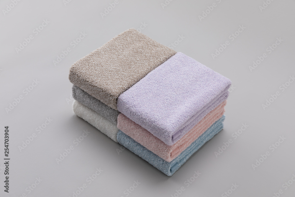 Towels folded on a grey background Towels folded on a grey background