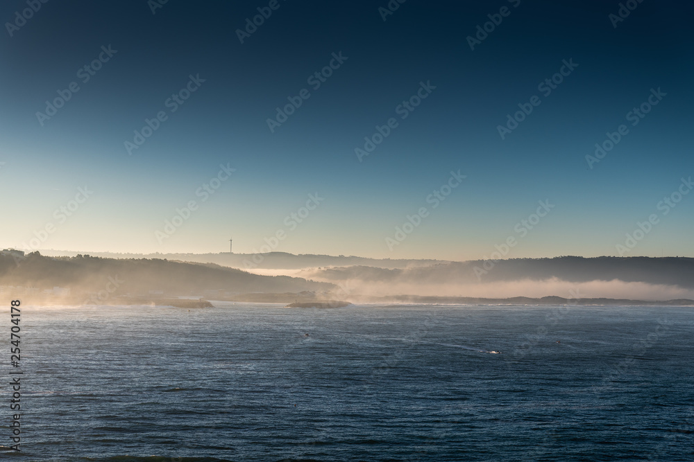 Fototapeta premium Morning at Atlantic ocean coast, Nazare, Portugal.