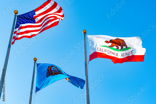 Three flags in front of Beverly Hills City Hall. Los Angelos, California. photo