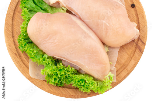  Raw chicken breast fillets on wooden cutting board isolated on white background