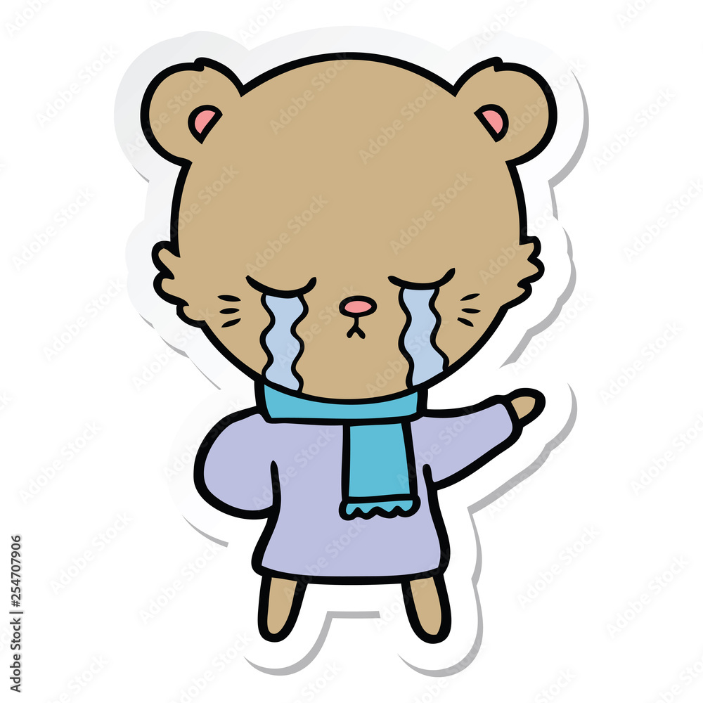 sticker of a crying cartoon bear wearing winter clothes sticker of a crying cartoon bear wearing winter clothes