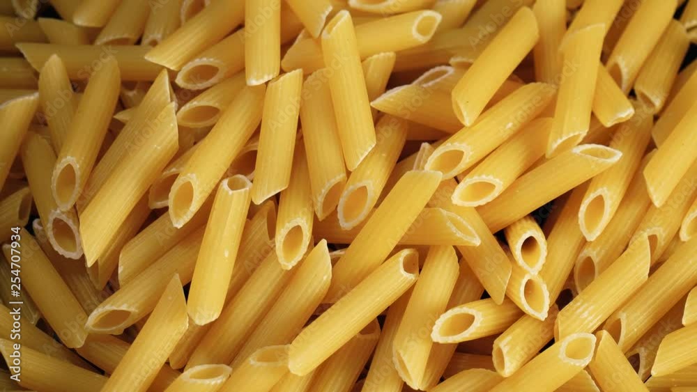 Pasta penne from above rotating Pasta penne from above rotating