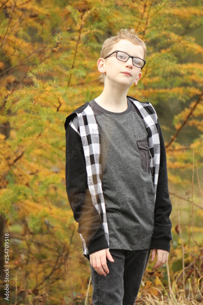 portrait of young man in autumn forest