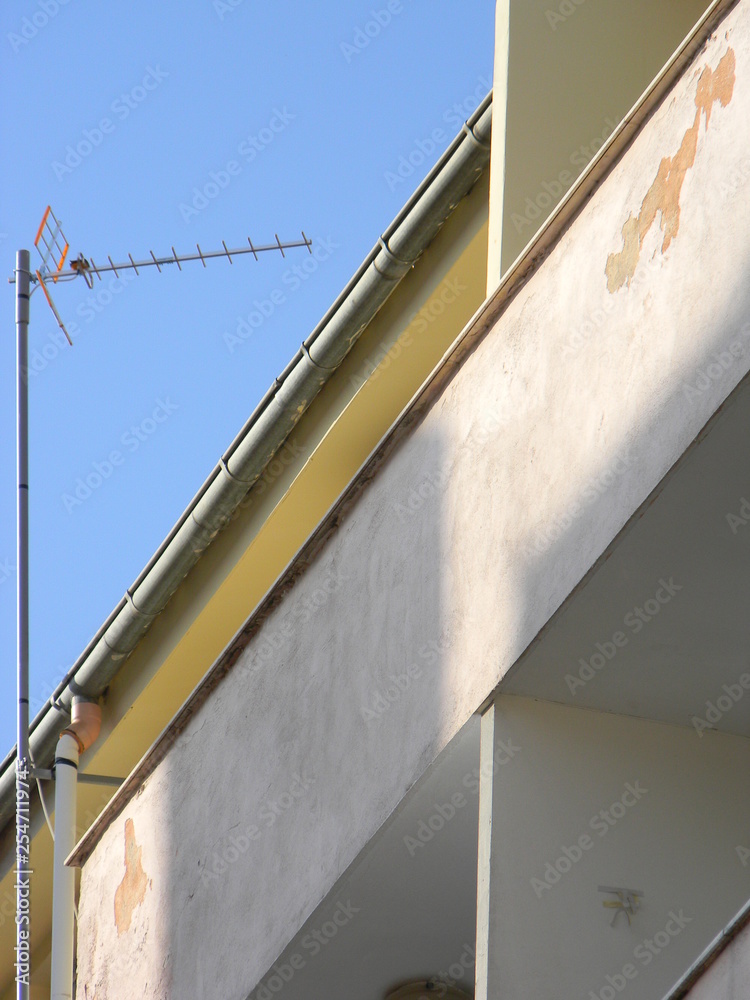 A tv antenna mounted on a residential building, Tirana, Albania A tv antenna mounted on a residential building, Tirana, Albania