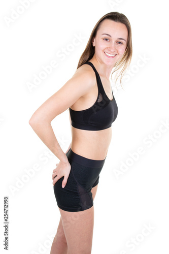 Full body portrait of athletic young pretty smiling woman under white background