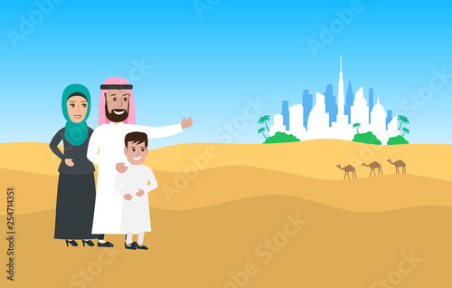 arab family wearing traditonal clothes in desert dunes