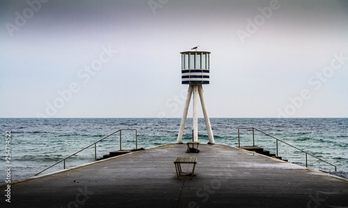 Fototapeta Naklejka Na Ścianę i Meble -  lifeguard tower at the end of a pier 