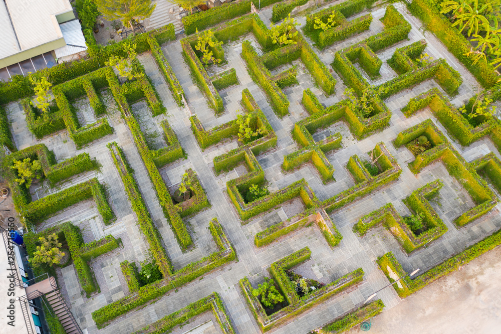 Aerial photo top view medium altitude above of maze green park garden