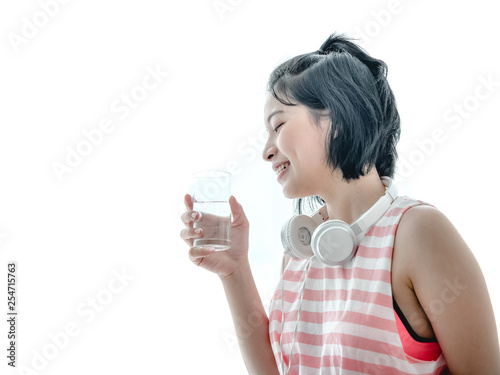 Asian girl drink water in fitness
