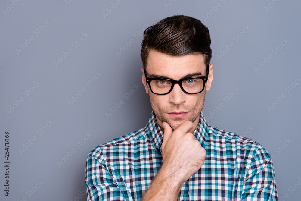 Close-up portrait of nice well-groomed handsome attractive minded guy wearing checked shirt touching chin thinking isolated over gray pastel background Close-up portrait of nice well-groomed handsome attractive minded guy wearing checked shirt touching chin thinking isolated over gray pastel background