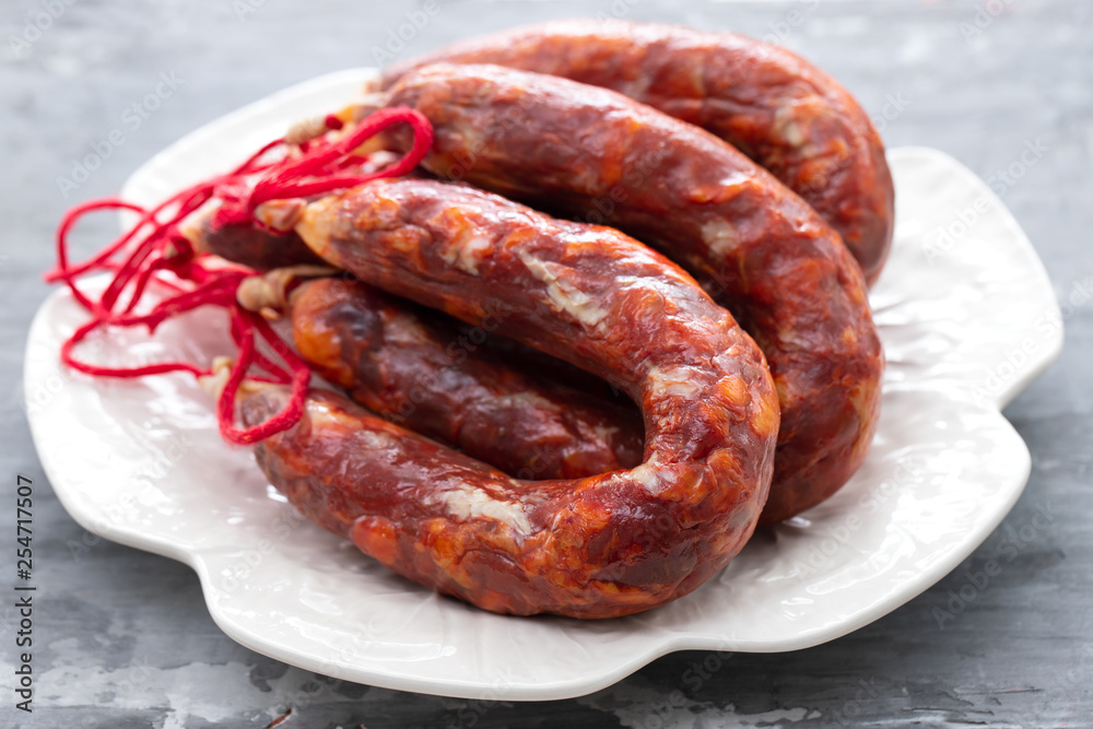 typical portuguese smoked sausages on beautiful white dish typical portuguese smoked sausages on beautiful white dish