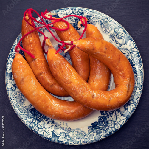 portuguese smoked sausages farinheira on beautiful dish photo