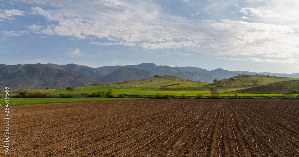 Farm fields, countryside and mountains  