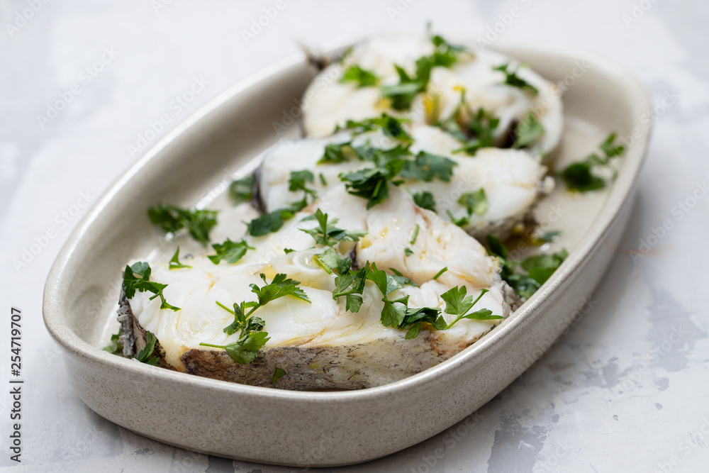 boiled perch with parsley and olive oil on dish