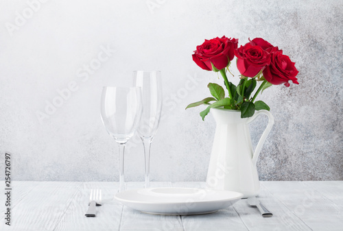 Dinner setting with rose flowers bouquet