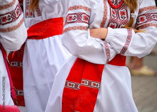 Unknown people in national Ukrainian clothes on the square of the city on the constitution day. The constitution day — a public holiday.