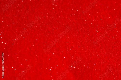 Red glitter texture christmas abstract background. Shiny wrapping paper texture, greeting card design element.