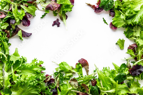 organic food pattern with green and red salads mix white background top view space for text